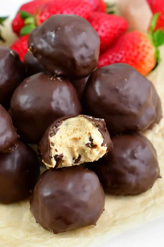 Chocolate-Peanut-Butter-Cheesecake-Bites-stacked-with-bite-taken-out
