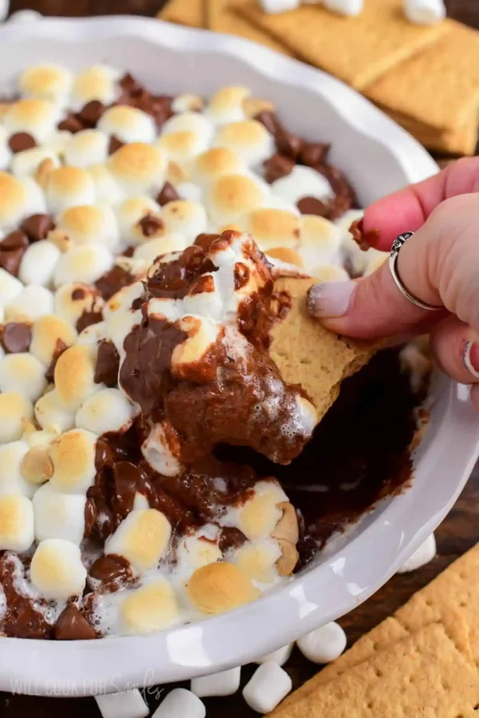 Hot-Chocolate-Cheesecake-Dip-scooping-with-cracker
