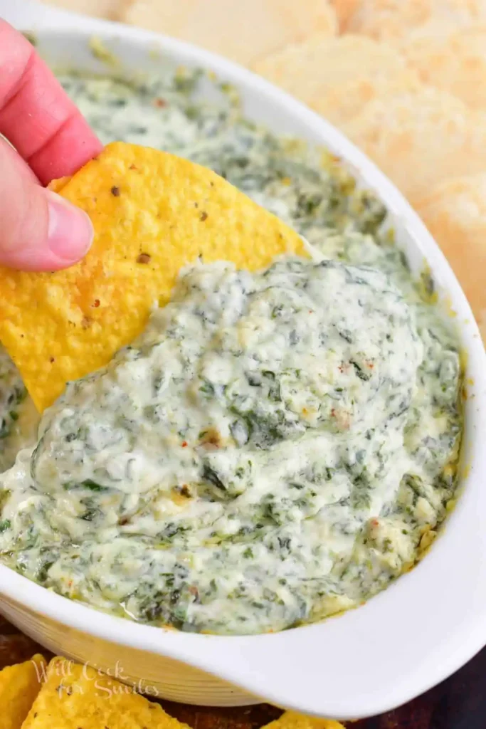 Parmesan-Spinach-Dip-scooping-with-tortilla-chip