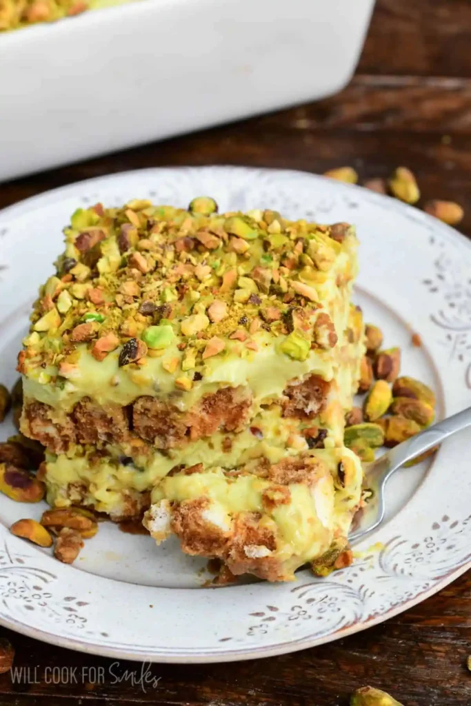 Pistachio-Tiramisu-on-a-plate-with-some-on-a-fork